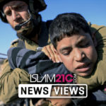 A Palestinian child held by a Zionist soldier in Israeli IDF