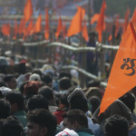 RSS supporters wave their flag during a rally in India.